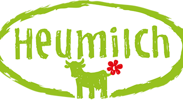 Logo mit Schriftzug Heumilch und Kuh